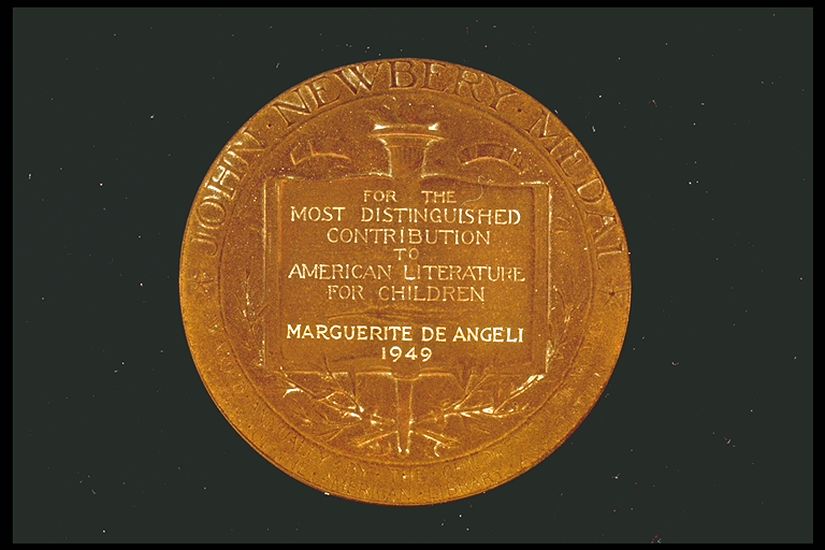 Image of Newbery Medal back with black background